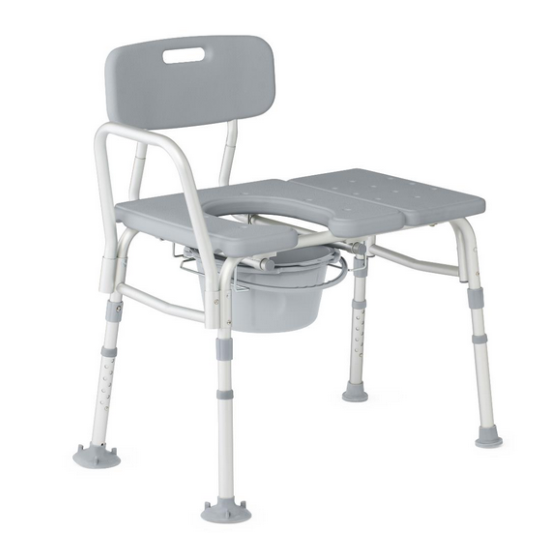 The Medline Bariatric Combination Transfer Bench and Commode is a gray shower chair with a backrest, adjustable legs, a built-in seat with removable section for access to the commode bucket underneath, ideal for people with mobility challenges. It also features non-slip feet for stability.